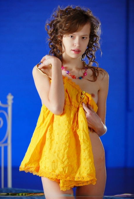 Skinny Russian teen Kitana A slips out of her yellow dress for nude posing 70635110