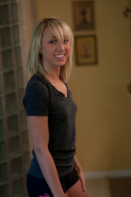 Blonde amateur Kelly captured on hidden camera styling her hair in shorts 20928811