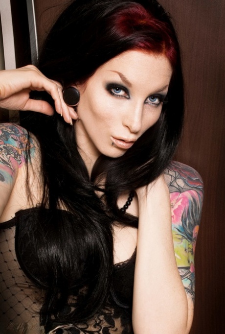 Tattooed redhead Razor Candi removes sexy lingerie and hosiery on her bed 10332603