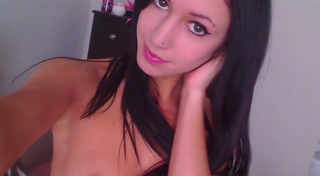 Horny teen Catie Minx takes a sex toy to her pink pussy atop her bed 73295497