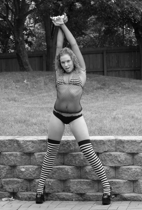 Teen solo girl Meganqt pulls down her panties while wearing long socks 10038483