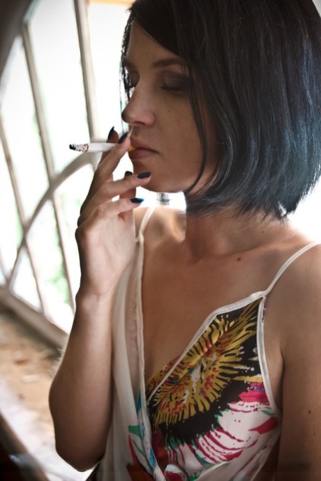 Petite teen Lana W smokes a cigarette before fingering her tight slit 50882772