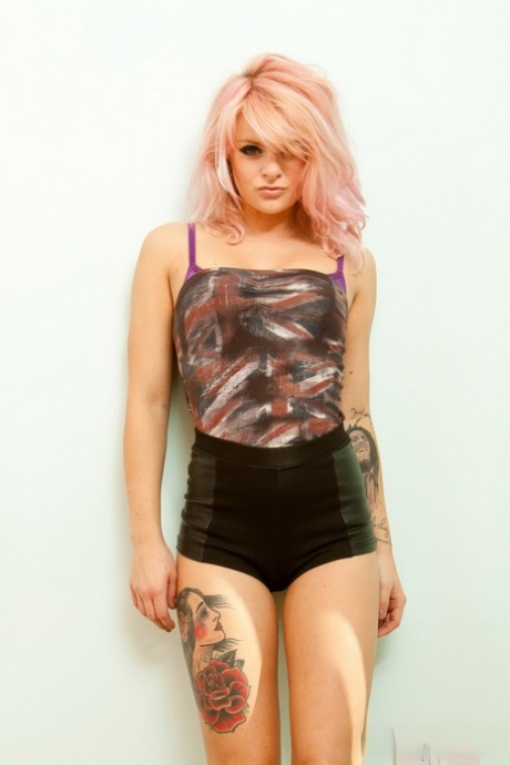 Petite British teen Rachael Lauren sets her tattooed body free of clothing 44904059