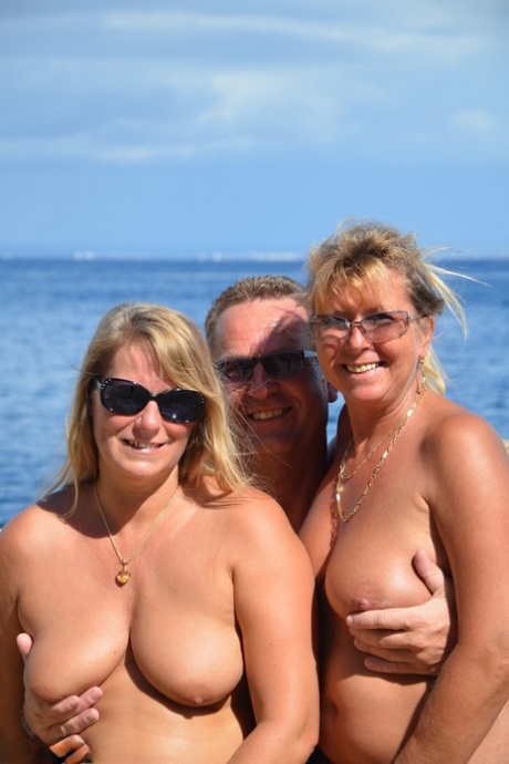 Two blonde women with saggy tits enjoy hot suck and fuck in beach threesome 30450859