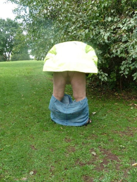 Fat British woman Grandma Libby exposes herself by a tree in a park 42334349