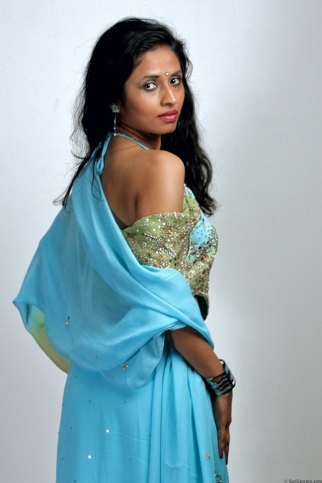Indian woman models in a strapless bra and panties paired with red hosiery 59403765