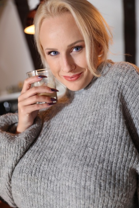 Thick blond Angel Wicky looses her big tits and pierced nipples from a sweater 43528338