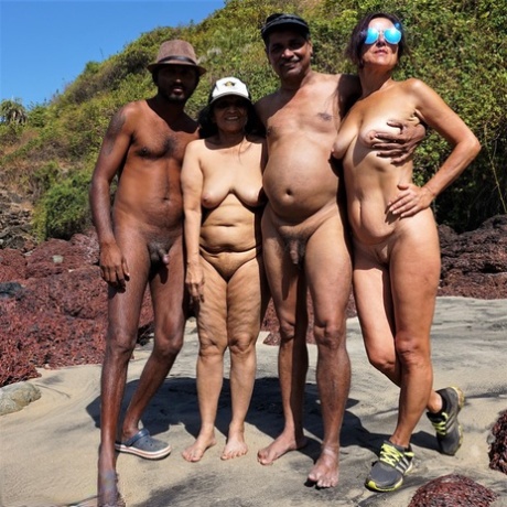 Mature amateur Diana Ananta is joined on the beach by her nudist friends 41435276
