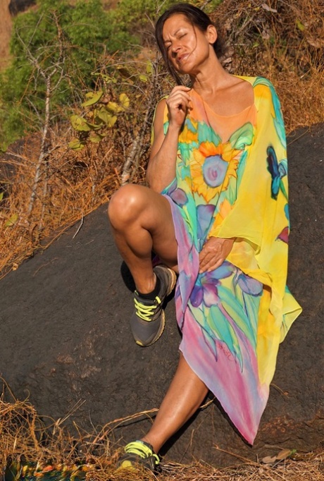 Older lady Diana Ananta exposes herself during a hike to a shrine atop a cliff 43686063