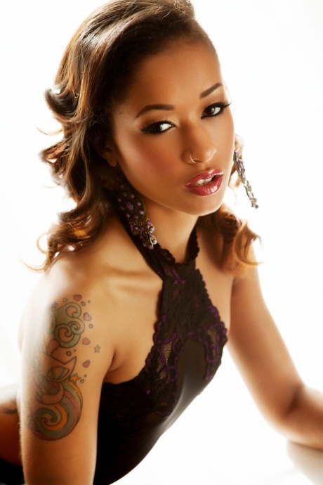 Ebony beauty Skin Diamond hits upon great poses during a centerfold shoot 35117041
