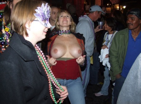 Inebriated girls expose their breasts during an outdoor gathering 37863981