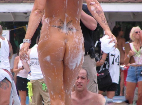 Amateur girls get naked during a strip show at a clothing optional club 58395209