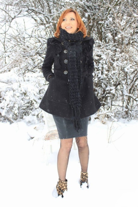 Sexy Vixen Nylons plays in the snow like a sex kitten in stockings 17872331