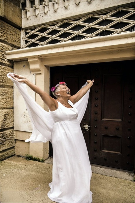 Blonde granny Savana models non nude in a long white gown 96394723