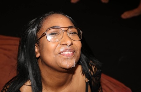 Busty black girl gets on her knees in glasses for bukkake action 10417166