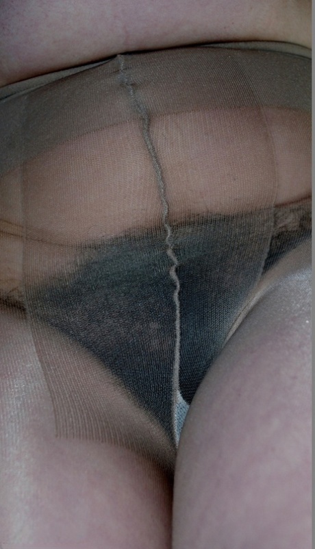 UK amateur Juicey Janey holds her big natural tits in pantyhose and heels 23059230