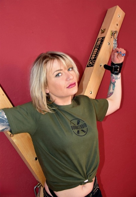 Tattooed blonde ends up ball gagged while restrained to a St Andrew's Cross 55697238