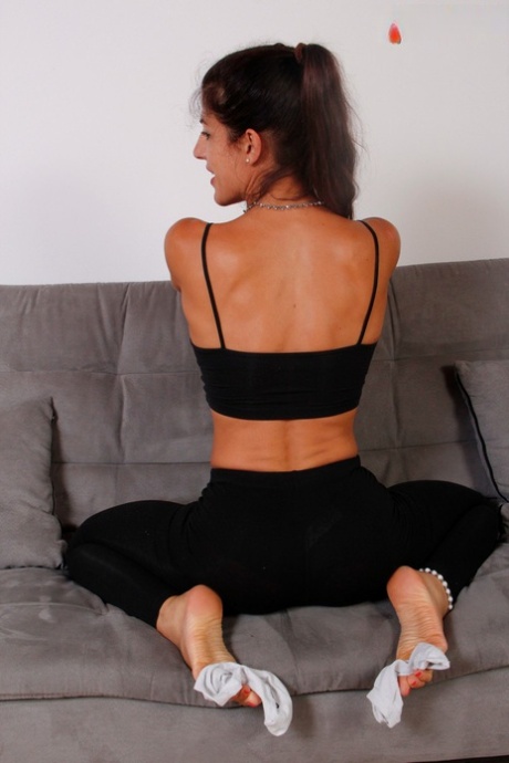 Brunette girl Bianca Blance exposes her pretty feet while wearing leisure wear 70695268