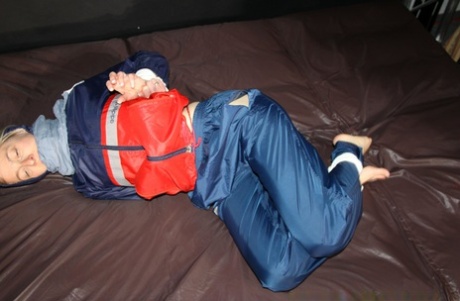 Caucasian amateur Sonja is tied up while wearing nylon rain gear 88071993