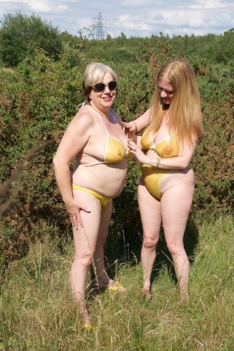 UK lady Speedy Bee and her younger lesbian lover fondle each other in bikinis 65770766