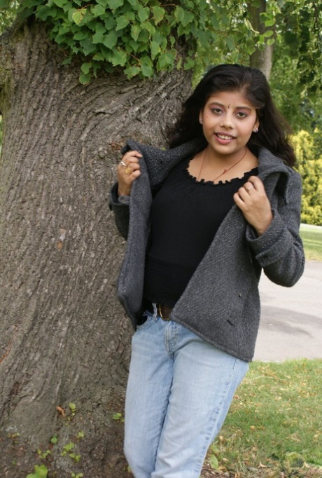 Cute Indian girl Rupali exposes her nice tits while underneath a tree 12722565