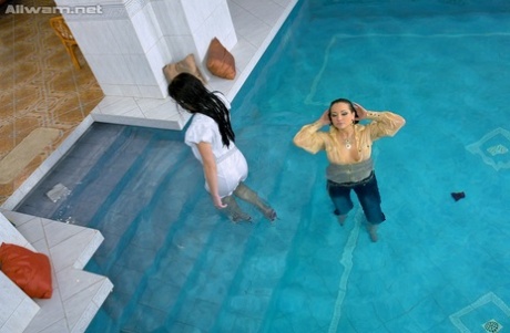 Fully clothed european vixens have some lesbian fun in the pool 93443647